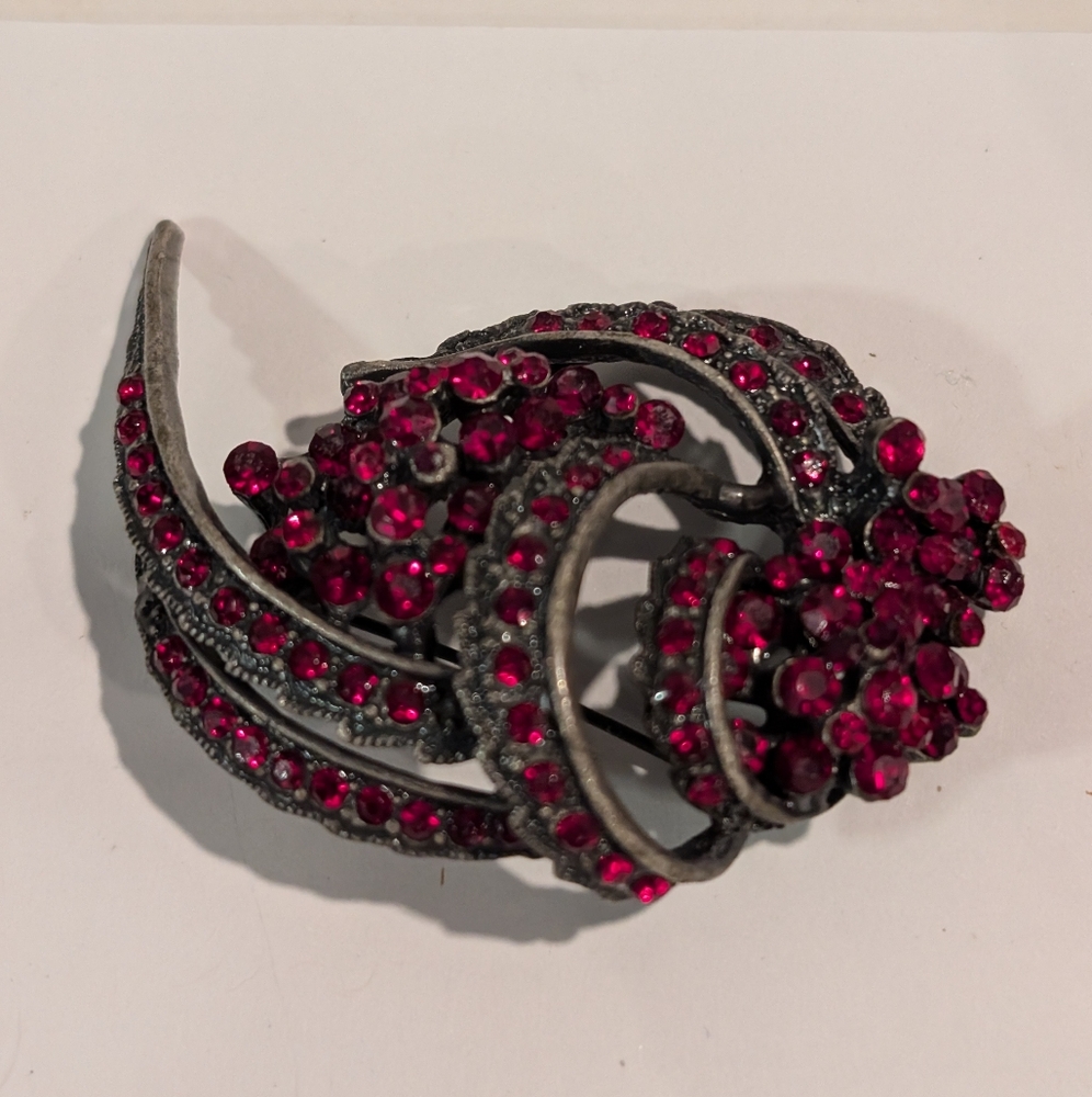 An antique Bohemian garnet brooch featuring rose-cut looking garnets.